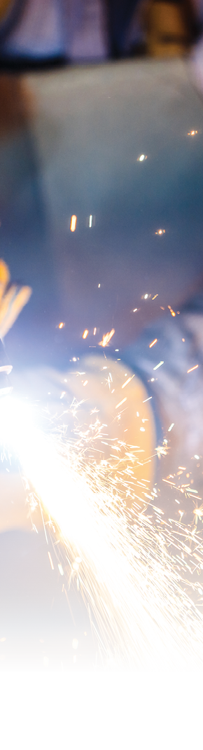Worker cutting metal with plasma equipment on plant 